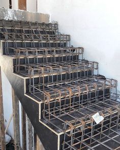 several metal bars are stacked on top of each other in order to be used for construction