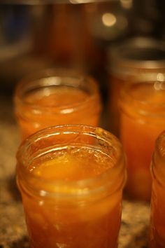 jars filled with liquid sitting on top of a counter