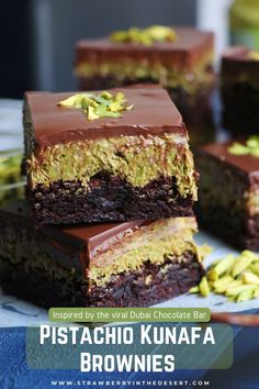 chocolate brownies stacked on top of each other with pistachio in the middle