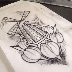 a drawing of tulips and a windmill on a piece of paper that has been drawn