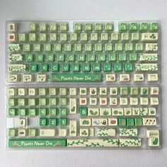 a green and white computer keyboard sitting on top of a table