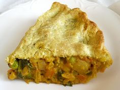 a slice of vegetable pie on a white plate