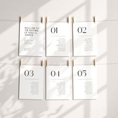 a set of six wedding seating cards on clothes pins with the numbers 0 to 10