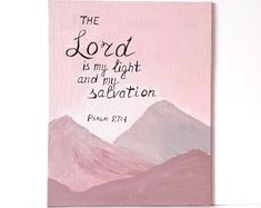 the lord is my light and my salvation bible verse on pink background with mountain scene