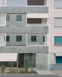 an apartment building with several balconies and windows