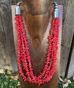 Add a pop of color to your outfit with this beautiful multi-strand necklace. Made with high-quality materials, this piece features red coral beads on a 24-inch sterling silver chain. The beaded design adds a touch of bohemian style, while the bamboo material gives it a unique texture. Perfect for any occasion, this necklace is sure to make a statement. With a Southwestern-inspired design, this necklace is perfect for those who love ethnic and regional styles. The .925 metal purity ensures durabi Multi-strand Red Coral Beaded Necklaces, Coral Multi-strand Beaded Necklaces, Coral Multi-strand Beaded Necklace, Coral Red Multi-strand Beaded Necklaces, Multi-strand Red Coral Beaded Necklace As Gift, Multi-strand Red Coral Necklace, Multi-strand Red Coral Beaded Necklace For Gift, Multi-strand Red Coral Necklace With Polished Beads, Multi-strand Red Coral Jewelry Gift