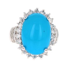 The Oval Cut Turquoise is 8.55 Carats and is surrounded by a Halo of beautifully set diamonds. There are 36 Round Cut Diamonds that weigh 1.15 Carats (Clarity: SI2, Color: F). The total carat weight of the ring is 9.70 Carats. The ring is crafted in 14 Karat White Gold and weighs approximately 12.1 grams Ring size = 7 (Free ring sizing upon request) Luxury Turquoise Ring With Gemstone Accents For Anniversary, Luxury Turquoise Jewelry With Center Stone, Formal Fine Jewelry Turquoise Ring With Accent Stones, Formal Turquoise Rings With Gemstone Accents, Elegant Multi-stone Turquoise Gemstones, Elegant Turquoise Cabochon Gemstones, Elegant Oval Cabochon Turquoise Ring For Formal Events, Elegant Oval Cabochon Turquoise Ring For Formal Occasions, Luxury Blue Turquoise Ring For Formal Occasions