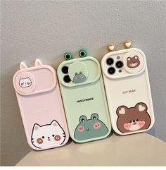 four phone cases with cartoon animals on them