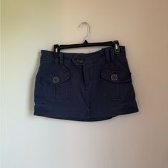 Brand New Vintage Skirt With Large Buttons On The Pockets And Closure 100% Cotton Blue High Waist Cotton Cargo Skirt, Fitted Blue Mini Cargo Skirt, Blue Short Denim Skirt With Pockets, Mid-rise Blue Mini Skirt With Pockets, Casual Navy Skort With Lined Skirt, Blue Mini Skirt With Pockets, Casual Navy Lined Skort, Casual Blue Short Mini Skirt, Casual Blue Cotton Cargo Skirt