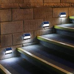 some steps with lights on them and the words light up for your stairs like a welcome path