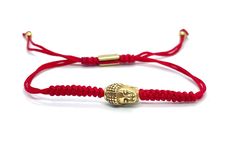 "This red braided bracelet is an everyday wear jewelry. Symbolizes luck, good fortune and protection. The red nylon cord is strong and it will not fade with water, the Buddha charm is made of stainless steel gold toned, and it will not tarnish or fade with water.  This bracelet is one of my favorite bracelets because it is confortable and durable, it can be combined with any other jewelry and it will keep that delicate look at all times.  Nylon cord 1.5 mm double row, this bracelet is adjustable Adjustable Braided Red Jewelry, Red Braided Bracelets With Adjustable Nylon Cord, Red Braided Bracelet With Adjustable Nylon Cord, Red Braided Nylon Bracelets With Adjustable Cord, Adjustable Red Braided Nylon Cord Bracelet, Red Braided Jewelry As A Gift, Red Braided Jewelry Perfect As A Gift, Adjustable Red Braided Nylon Bracelet, Red Braided Jewelry For Gifts