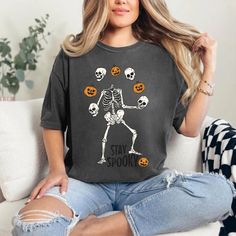 Skeleton Halloween Shirt, Stay Spooky Shirt, Dancing Skeleton Shirt, Retro Halloween Sweatshirt, Womens Halloween, Spooky Season, Gifts Hello! Welcome to Cstm Tshrt Designs, Discover our premium personalized t-shirts crafted from luxurious materials that provide a delightful feel against your skin. Choose from a diverse array of colors and designs to find a shirt that perfectly aligns with your unique personality and style preferences. Whether you seek a humorous graphic tee, a bold statement pi Halloween Skull Letter Print Tops, Dancing Skeleton, Stay Spooky, Skeleton Halloween, Skeleton Shirt, Tshirt Crafts, Personalized Clothes, Halloween Spooky, Retro Halloween