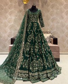 Made to Order/Measurement/Custom Order Lehenga - Color : green - Fabric : Embroidered Georgette - Fully flared paneled lehenga - Embroidered  Blouse -  Net Dupatta with Gold Border - Drawstring closure with Tassels - - It can be customize in any design or size  PLEASE NOTE: BUYERS ARE RESPONSIBLE FOR ANY CUSTOMS AND IMPORT TAXES THAT MAY APPLY. This is a made to order product. If you opt for 'Made To Measurement Option', we will provide a measurement template and you can share the measurements likewise. If you want to opt for 'Standard Size', Please refer to the size chart provided in the listing. Shipping: Standard Shipping is done by DHL ecommerce and it mostly takes 2 to 3 weeks to deliver after dispatch. Express Shipping is done by DHL express and it mostly delivers within a week after Bollywood Green Lehenga With Intricate Embroidery, Designer Green Choli With Intricate Embroidery, Unstitched Green Lehenga With Intricate Embroidery, Green Unstitched Lehenga With Intricate Embroidery, Green Dresses With Intricate Embroidery And Traditional Drape, Fitted Dark Green Dress For Wedding, Form-fitting Dark Green Dress For Wedding, Fitted Dark Green Wedding Dress, Traditional Green Lehenga With Intricate Embroidery