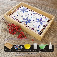 a wooden tray with different types of mosaic tiles on it and instructions for how to use them