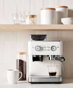 an espresso machine sitting on top of a counter