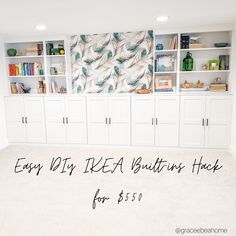 an empty room with lots of white cabinets and bookshelves on the wall, next to a carpeted floor