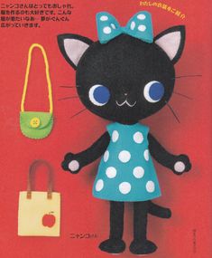 a black cat with blue eyes and a polka dot dress standing next to a handbag