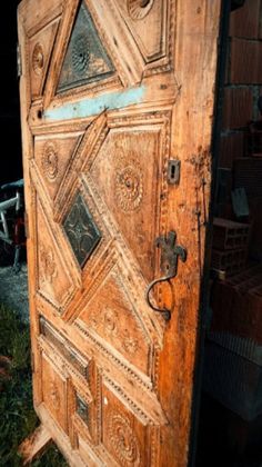 an old wooden door with intricate carvings on it