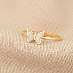 Discover the whimsical charm and luxurious craftsmanship of our 14K Gold Butterfly Ring. This enchanting piece captures the delicate beauty of butterflies, offered in a palette of blue, pink, or white enamel, and is meticulously handcrafted in your choice of gold, rose gold, or white gold. Ideal for adding a touch of nature-inspired elegance to any ensemble, it's a stunning and versatile addition to any jewelry collection. Key Features: Elegant Aesthetics: The ring features a detailed butterfly Pink Jewellery Aesthetic, Butterfly Ring Gold, Butterfly Ring Aesthetic, Butterfly Gold Ring, Detailed Butterfly, Butterfly Jewellery, Enamel Rings, Gold Butterfly Ring, Butterfly Motif