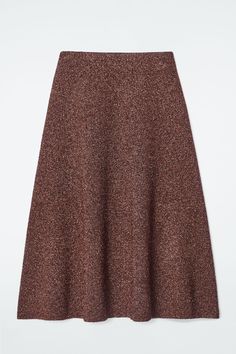 A prelude to party season, this midi skirt is knitted from premium merino wool with metalized fibers that beautifully catch the light. It's double-faced with a soft camel-hued interior and cut in a voluminous A-line shape. Style it with the coordinating cardigan for maximum impact. Regular fitThis product contains Responsible Wool Standard TE-00047206 (RWS) wool fiber from farms certified to animal welfare and land-management requirements Shell: 55% Merino wool, 23% Metalized fiber, 18% Recycled Wool Midi Skirt, Land Management, Brown Interior, Wool Skirt, Vest Shirt, Animal Welfare, Wool Skirts, Quilted Bag, Cardigan Coat