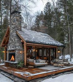 a cabin in the woods with snow on the ground