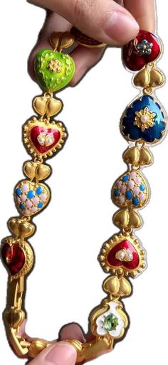 Gold Decorative Dangle Jewelry, Traditional Gold Heart Jewelry, Traditional Gold Heart-shaped Jewelry, Gold Enamel Heart-shaped Earrings, Gold Heart-shaped Enamel Earrings, Gold Heart-shaped Jeweled Jewelry, Gold Jeweled Heart Jewelry, Gold Enamel Earrings For Valentine's Day, Heart-shaped Multicolor Jewelry For Wedding