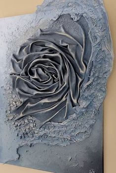 a painting on the wall with a rose in it