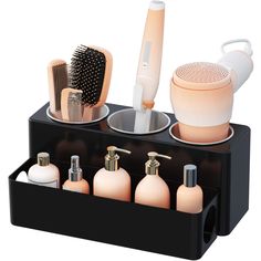 PRICES MAY VARY. Versatile Hair Dryer Stand: This hair tool organizer, measuring 11.8"(30.2 cm) x 7.3"(18.6 cm) x 5.2"(12. 5cm), is perfect for storing your hair dryer, iron, curling iron, straightener, as well as cosmetics, skincare products, brushes, and combs Heat-Resistant Tool Rack: This hair dryer holder features three heat-resistant stainless steel cups to serve as stands for hair dryer and curling iron, allowing them to cool down quickly. With a deep design, the cups provide stability an Hair Dryer Organization, Hair Appliance Storage, Hair Straightener Holder, Hair Dryer Organizer, Blow Dryer Holder, Organize Bathroom Countertop, Hair Dryer Stand, Hair Product Organization, Dryer Stand