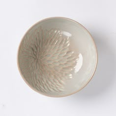 a white bowl sitting on top of a table