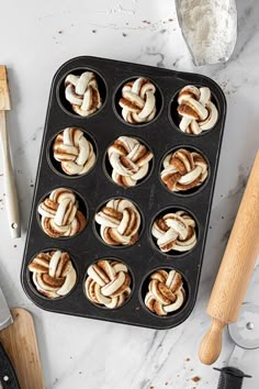 a muffin tin filled with cupcakes sitting on top of a counter