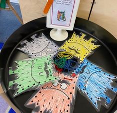 a child's art project on a black tray