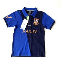 Joules Blue Harry Cut & Sew Polo Shirt. Size 6y Ships Fast, Direct From Boutique! Blue. New With Tags Short Sleeve Polo Embroidered Badging Color Block Detail Ribbed Cuffs And Collar Polo Shirt Colors, Embroidered Polo Shirts, Embroidered Badges, Blue Polo Shirts, Blue Polo, Boys Long Sleeve, Long Sleeve Polo, Short Sleeve Polo, Kids Shirts