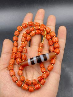 Excellence quality natural coral bead strand with 4 stripe antique dzi agate bead necklace Traditional Orange Single Strand Jewelry, Antique Orange Beaded Jewelry, Antique Orange Jewelry With Round Beads, Carved Amber Round Beads Jewelry, Natural Coral, Coral Jewelry, Coral Beads, Beaded Necklaces, Agate Beads