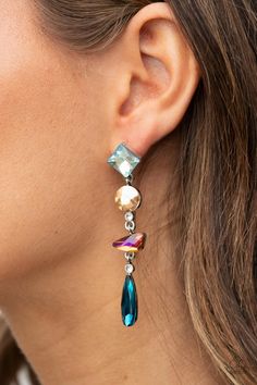 A mismatched collection of colorfully iridescent and brilliantly sparkling gems are linked together in elegant succession as they fall glamorously from the ear. Earring attaches to a standard post fitting.

 Sold as one pair of post earrings. Earrings Trendy, Gem Earrings, Rock Candy, Jewelry Images, Paparazzi Accessories, Blue Gems, Green Earrings, Paparazzi Jewelry, Rhinestone Earrings