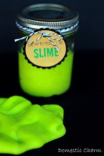 a jar of slime next to a green rubber hand