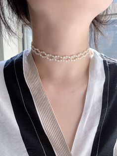 This pearl choker is made with tiny freshwater pearls. The tiny beads and spring rings are all made with 14K gold filled which is sensitive skin-friendly and guarantee long lasting wear. All of the freshwater pearls we picked are AAA luster. Also the necklace will come with a 2inches extender. Every Necklace will come with a jewelry box. 💗Material💗 Bead: 3mm-3.5mm Freshwater pearl, 2.5mm Gold filled bead Spring ring: 14K gold filled Extension chain: 2 inches/14K gold filled. one 6.5-7mm freshw Delicate Pearl Beaded Choker, Delicate Tiny Beads Pearl Necklace For Wedding, Delicate Pearl Necklace With Tiny Beads For Wedding, Dainty Pearl White Pearl Choker, Delicate Pearl Jewelry With Tiny Beads, Delicate Pearl Charm Choker, Delicate Pearl Chain Choker, Dainty Pearl Chain Choker, Dainty Pearl Choker With Pearl Charm