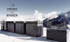 an advertisement for the design awards is shown in front of snow covered mountains and blue skies