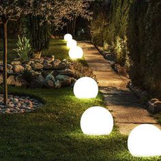 some lights that are sitting in the grass