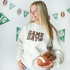 The Game Day Patch Adult Sweatshirt is a fun and cute sweatshirt for celebrating Game Day! Crewneck Color: Natural Patch Color: Brown and white chenille with white felt outline Material: 55% Cotton/45% Polyester Features: Tagless inside neck label for an itch-free wear; cozy pill-resistant fleece lining; pre-shrunk Fit: Adult Unisex Care: Machine washable, wash inside out, lay flat to dry, wash with like colors Each sweatshirt is hand pressed with love in our hometown warehouse. White Sports Fan Sweatshirt For Fall, White Sweatshirt For Game Day In Winter, White Lettering Sweatshirt For Game Day, White Crew Neck Sweater For Game Day, White Winter Game Day Sweatshirt, Cute Sweatshirts, Crew Neck, Sweatshirts, How To Wear