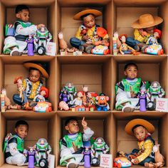 a box filled with toy figurines sitting on top of wooden shelves next to each other