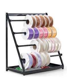 a rack that has many different colored spools on it