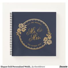 a blue notebook with gold lettering and flowers