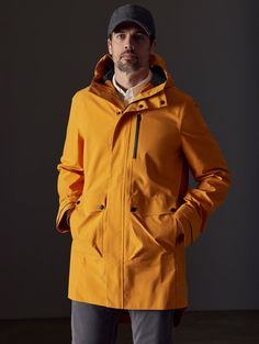 Front body view of man wearing Anders Rain Jacket in Midas Orange from AETHER Apparel. Modern Waterproof Raincoat For Workwear, Modern Nylon Outerwear For Rainy Weather, Modern Waterproof Outerwear For Outdoor, Waterproof Nylon Outerwear For Work, Modern Waterproof Nylon Outerwear, Functional Weatherproof Windbreaker For Work, Life Of Adventure, Mens Outerwear, We Wear