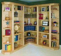 a corner bookcase with many books in it