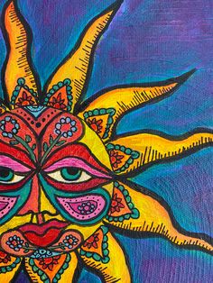 a painting of a yellow sun with blue eyes and an ornate design on the face