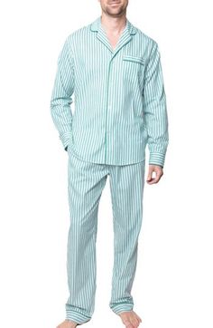 Comfort and elegance combine in these sweat-wicking cotton-twill pajamas boasting vintage-inspired ticking stripes and luxe piping tracing the edges. Top has front button closure; notched collar; long sleeves; chest patch pocket Pants have elastic/drawstring waist 100% cotton Machine wash, line dry Imported Ticking Stripe, Pocket Pants, Notched Collar, Ticks, Cotton Twill, Drawstring Waist, Piping, Patch Pocket, Pajama Set