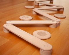 wooden toys sitting on top of a hard wood floor