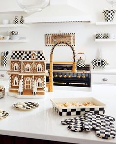 a kitchen counter with black and white checkered plates