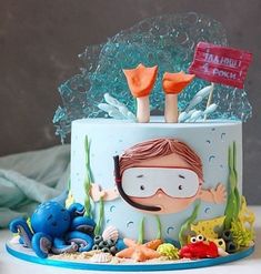 a cake decorated with an image of a child's scuba theme