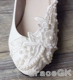 White Low Heel Ballet Flats For Formal Occasions, Elegant White Ballet Flats, Elegant Almond Toe Ballet Flats For Wedding, White Closed Toe Flats For Evening, Elegant White Almond Toe Ballet Flats, Elegant Flat White Wedding Shoes, Pearl Embellished Wedding Flats, White Low Heel Ballet Flats For Party, Elegant Cream Flat Wedding Shoes